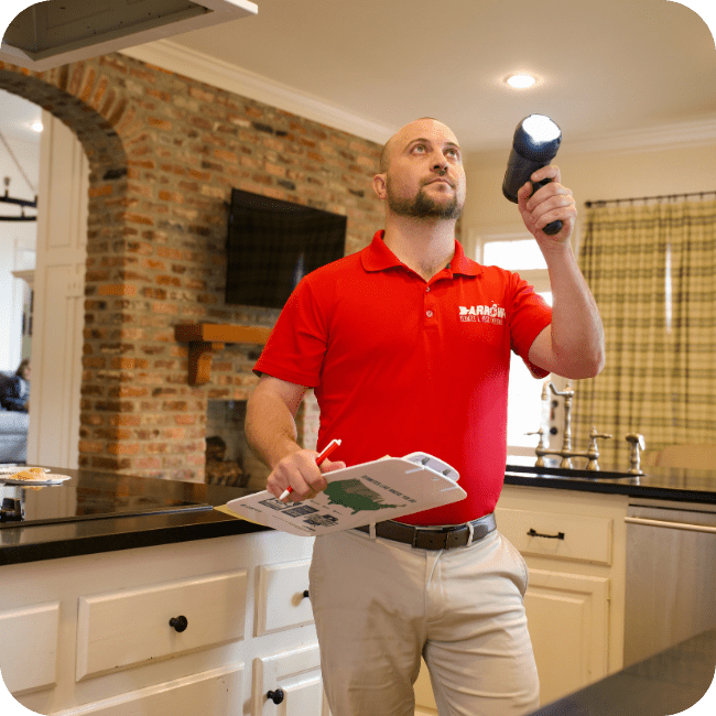 Termite technician performing a free termite inspection